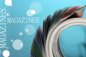 Rolled up magazines on blue background Rolled up magazines on blue background